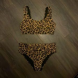 Like new! High waisted leopard print bikini with tie detail bottom. Super cute!!